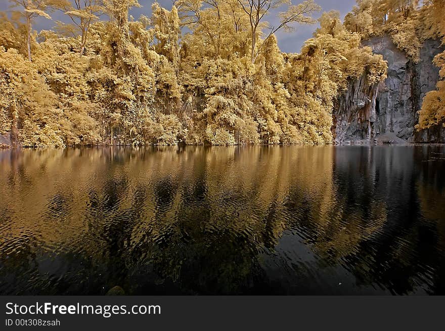 Infrared photo – lake, rock, and tree in the par