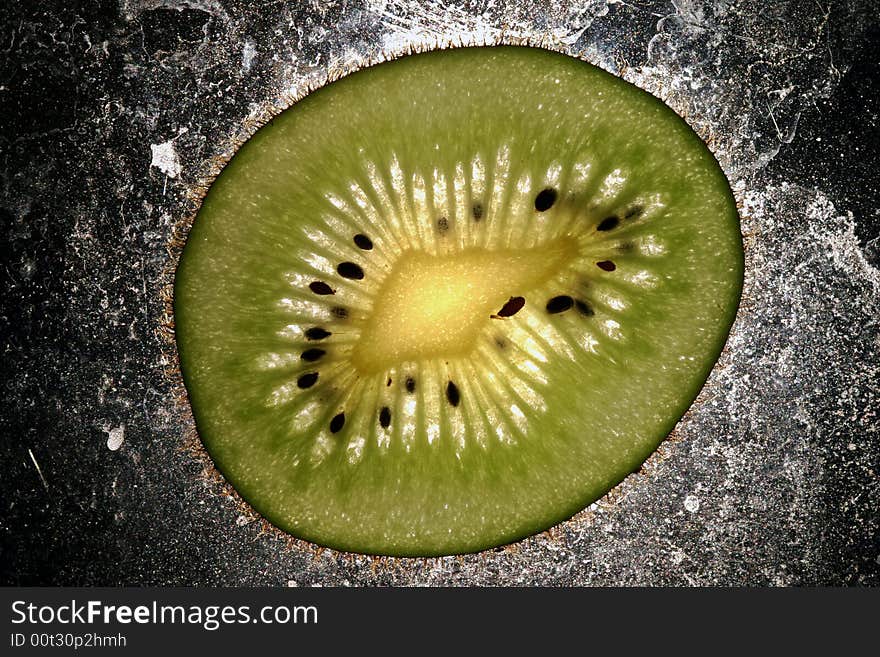 Kiwi cut with abstract background