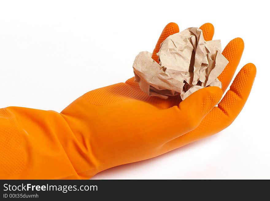 Arm in an orange glove and paper. Arm in an orange glove and paper