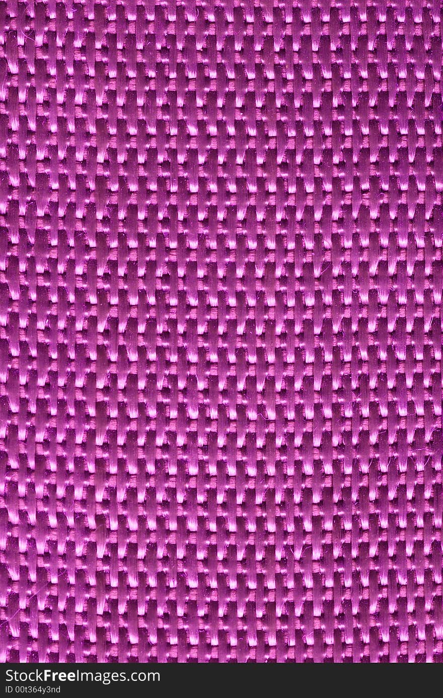 Macro of Magenta tightly woven fabric texture background. Macro of Magenta tightly woven fabric texture background