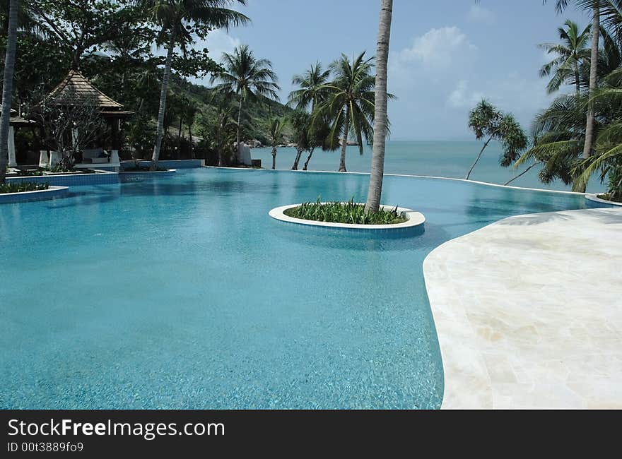 Tropical hotel with pool.