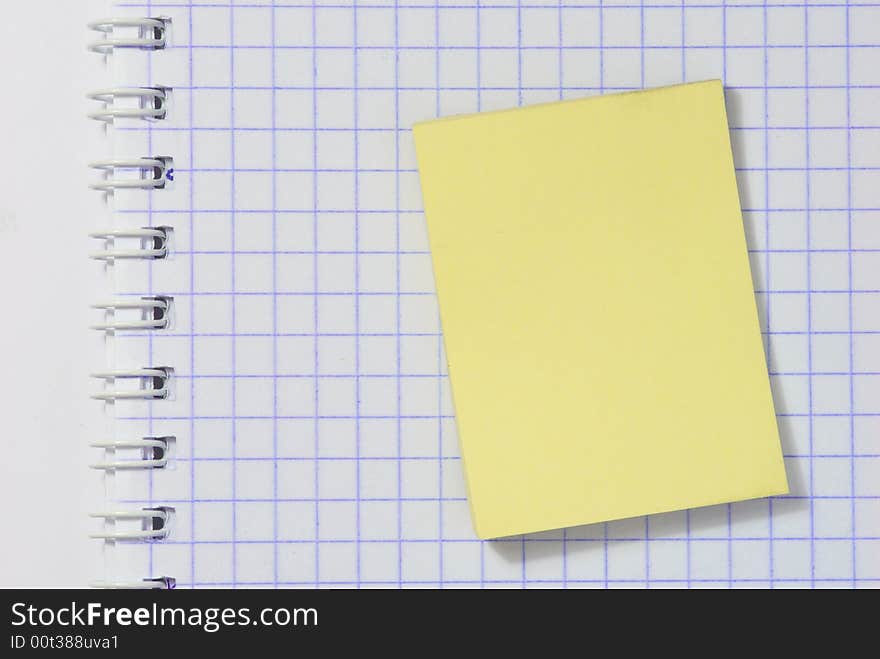 Yellow sticky notes on notebook