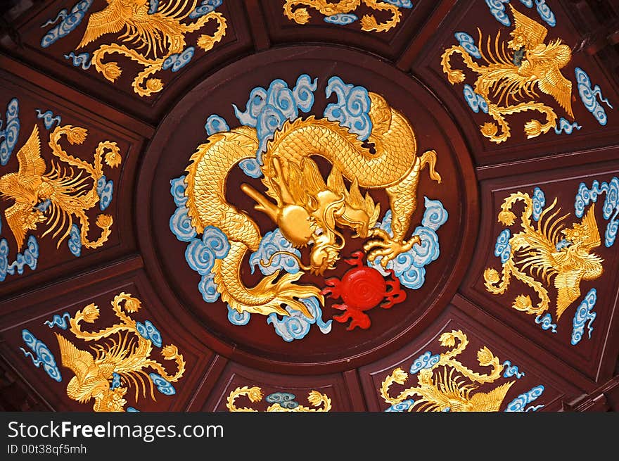 Chinese dragon crowded by phenixes. Chinese dragon crowded by phenixes