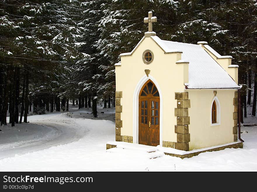 Small chapel in a snow-covered wood. Small chapel in a snow-covered wood