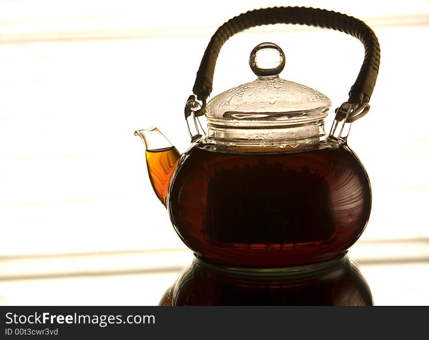 Teapot on the reflected background