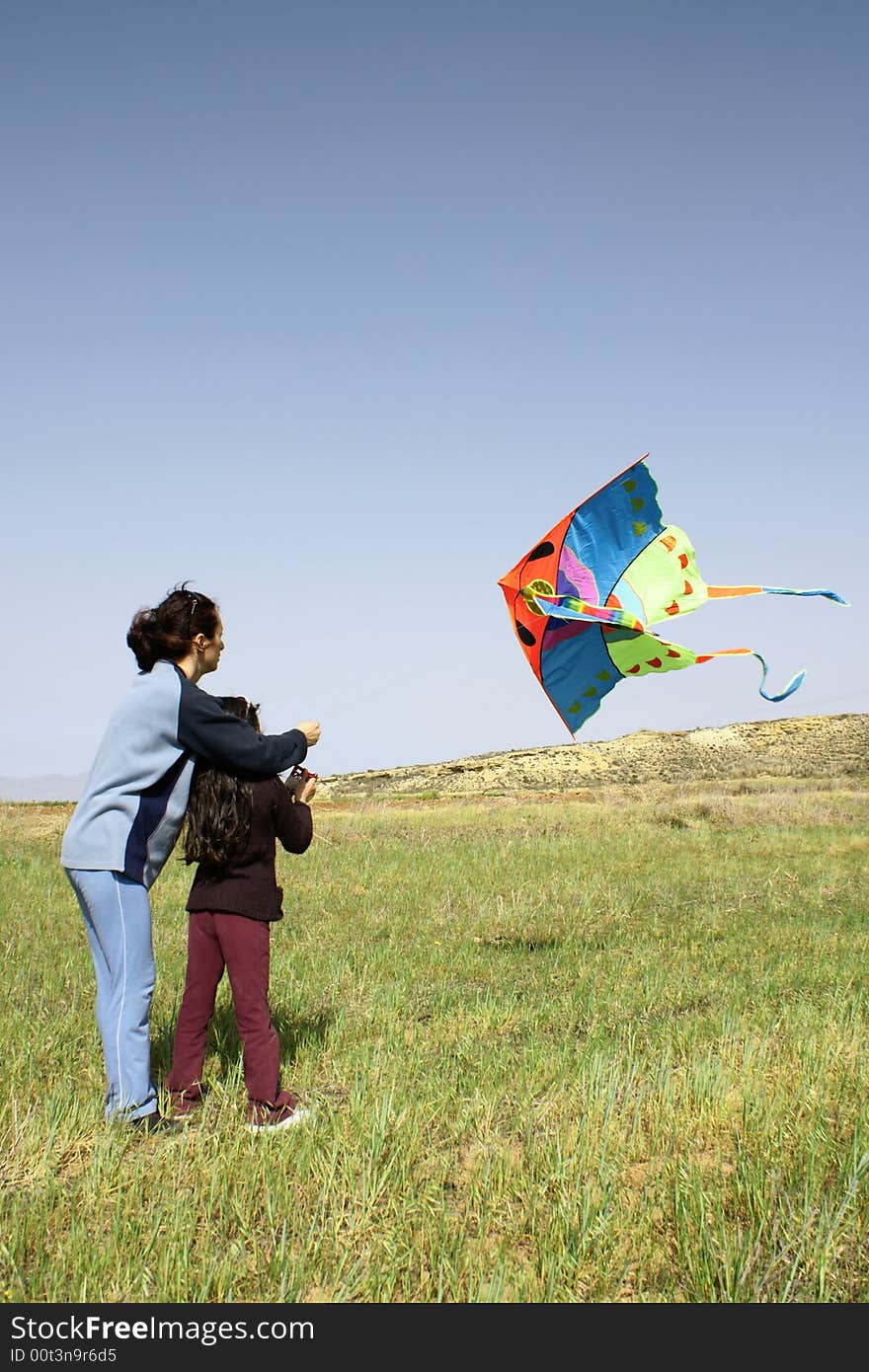 Mother and daughter with kite