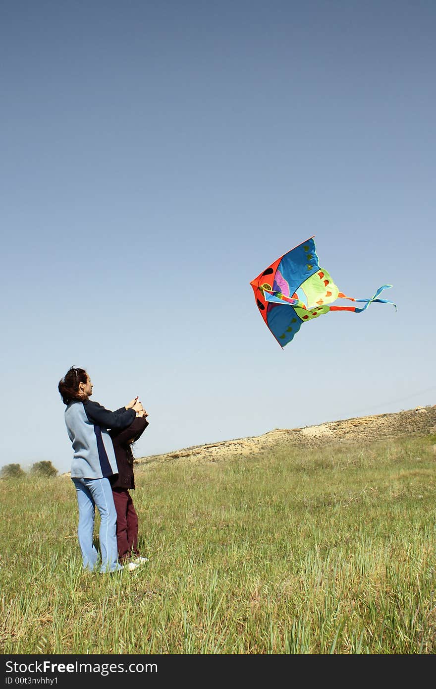 Mother and daughter with kite