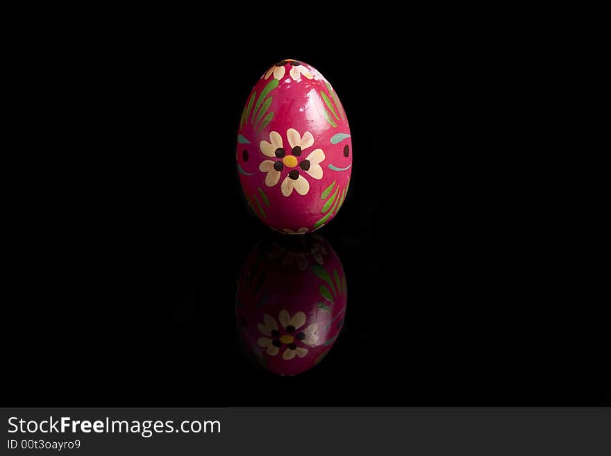 Easter eggs on black mirror, hand painted - isolated