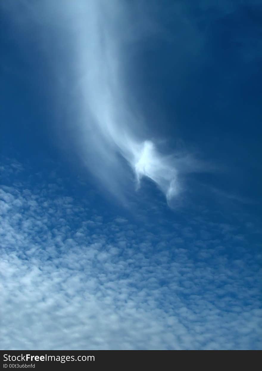 Cirrus clouds on blue sky