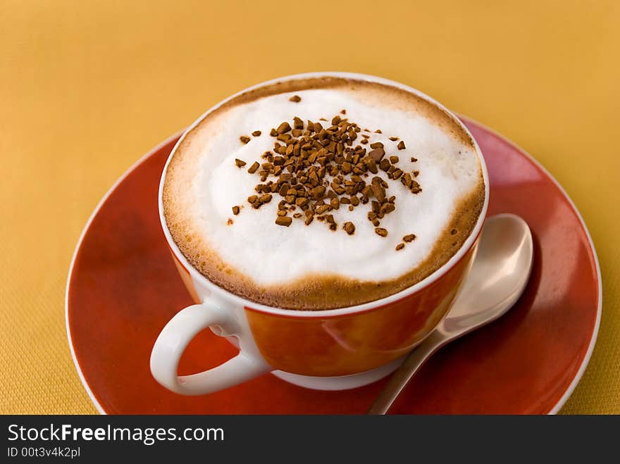 A cup of cappuccino with  decoration