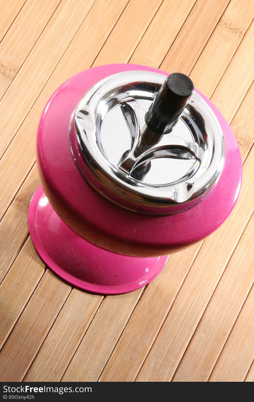 A pink ashtray in detail