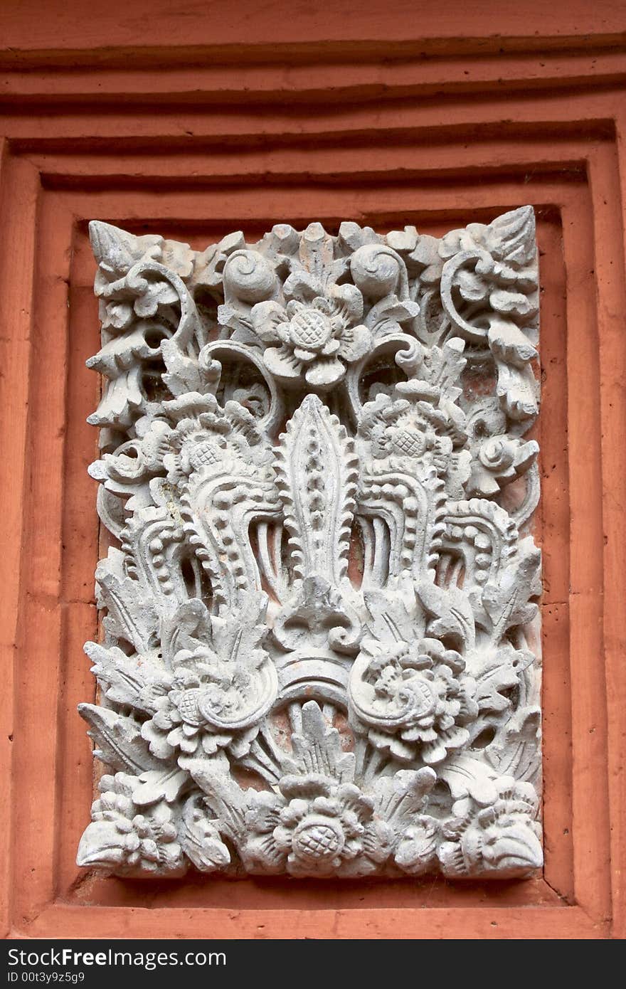 An intricate stone carving recessed into a wall, found in a private residence in Bali