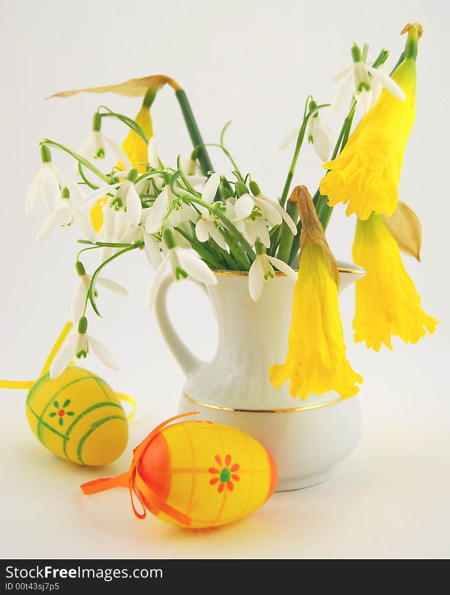 Easter eggs and spring flowers in still life