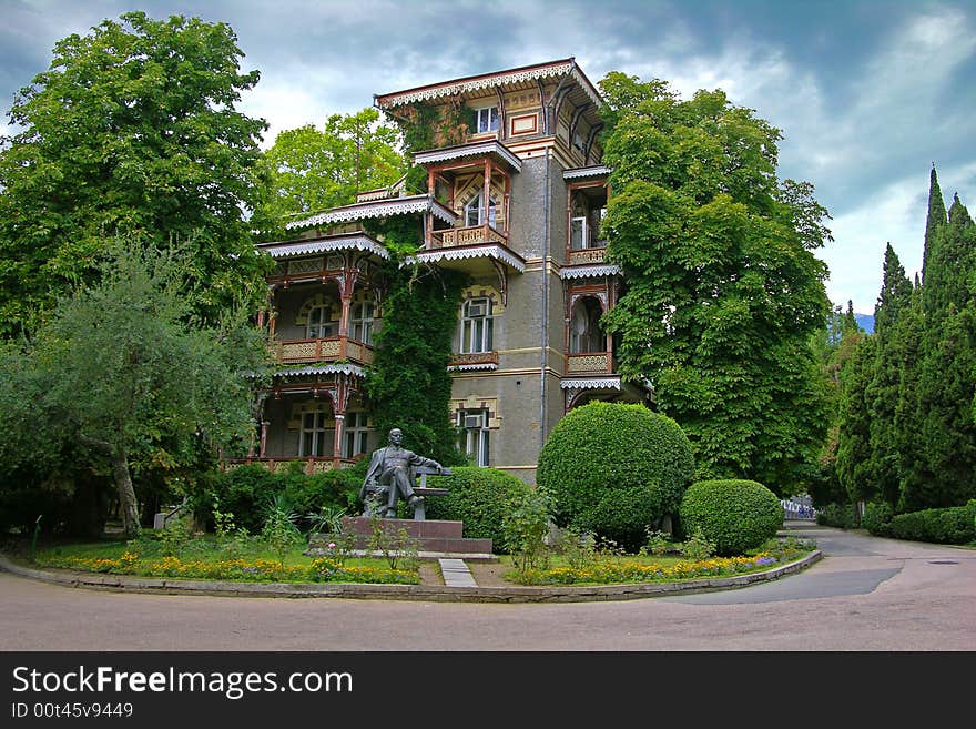 Sanatorium building in Gurzuf (Crimea Ukraine). The monument to Lenin is in a foreground. Sanatorium building in Gurzuf (Crimea Ukraine). The monument to Lenin is in a foreground.