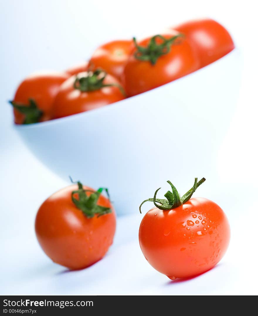 Delicious fresh cherry tomatoes over white