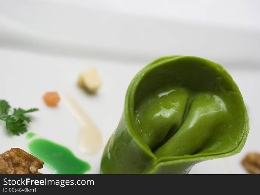 Home made lasagna verde tortellini being created and plated in professional kitchen. Home made lasagna verde tortellini being created and plated in professional kitchen