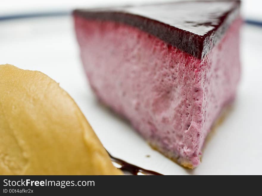 Cool high key macro crop shot of a black currant mousse with liqorice jelly and sorbet. Cool high key macro crop shot of a black currant mousse with liqorice jelly and sorbet