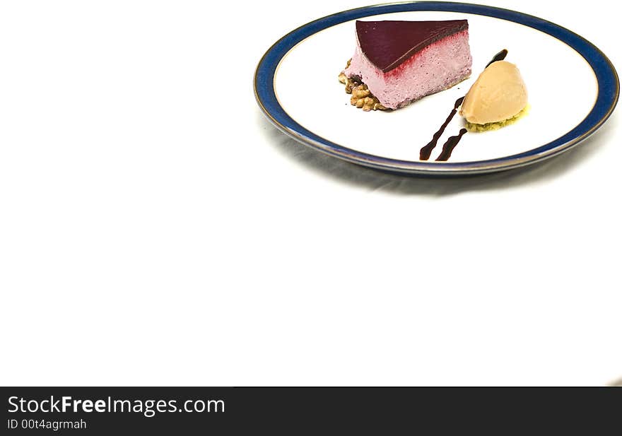 Cool high key shot of a black currant mousse with liqorice jelly and sorbet. Cool high key shot of a black currant mousse with liqorice jelly and sorbet