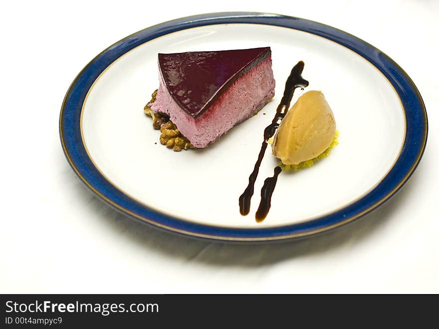 Cool high key shot of a black currant mousse with liqorice jelly and sorbet. Cool high key shot of a black currant mousse with liqorice jelly and sorbet