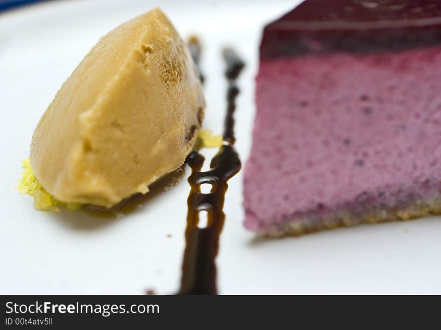 Cool high key macro crop shot of a black currant mousse with liqorice jelly and sorbet. Cool high key macro crop shot of a black currant mousse with liqorice jelly and sorbet