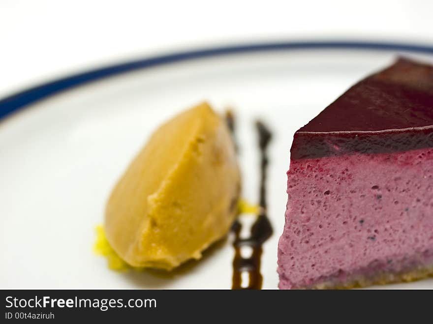 Cool high key macro crop shot of a black currant mousse with liqorice jelly and sorbet. Cool high key macro crop shot of a black currant mousse with liqorice jelly and sorbet