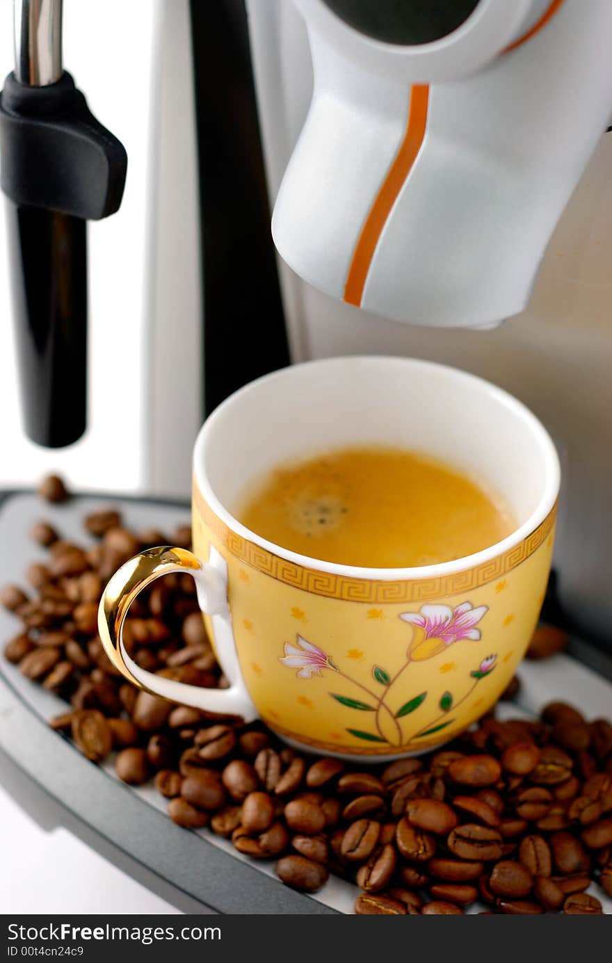 Style coffee machine with cup and beans. Close-up. Style coffee machine with cup and beans. Close-up.