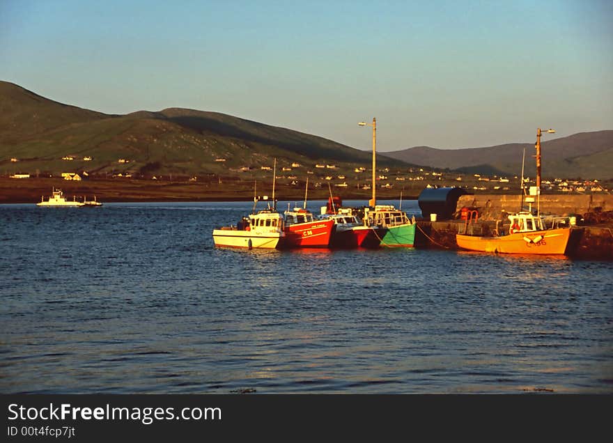 Colorful boats in the small harbor at Valencia Island, Western Ireland. Colorful boats in the small harbor at Valencia Island, Western Ireland