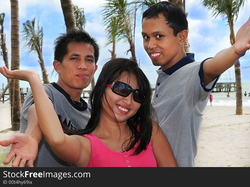 Three young asian at beach. Three young asian at beach