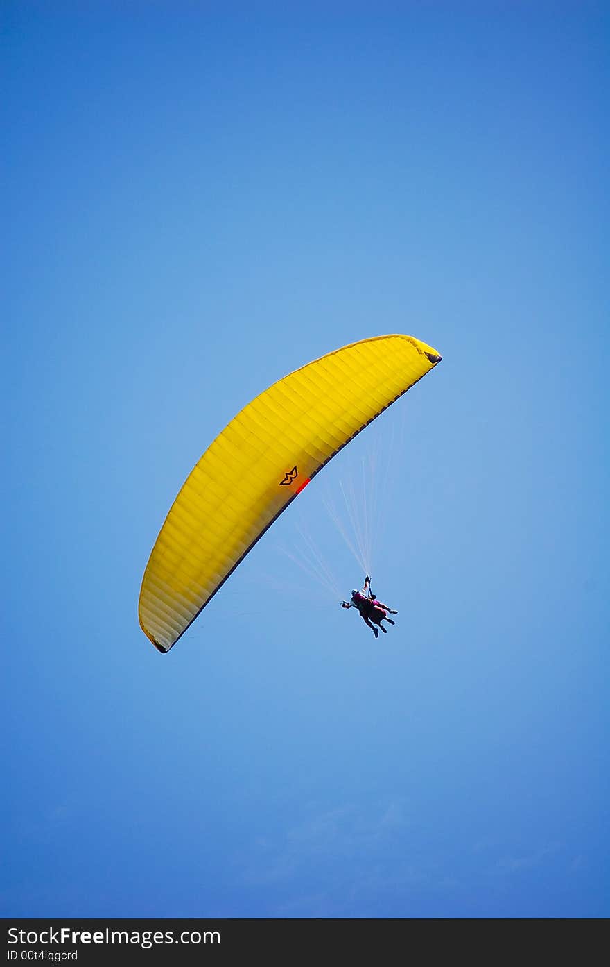 Biplace Paraglider in the blue sky