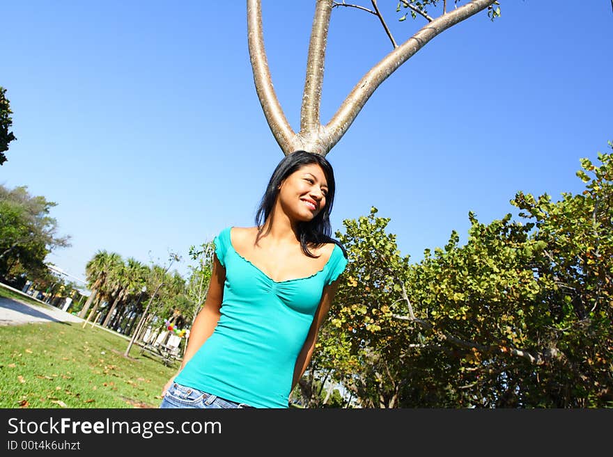 Woman Leaning On A Tree