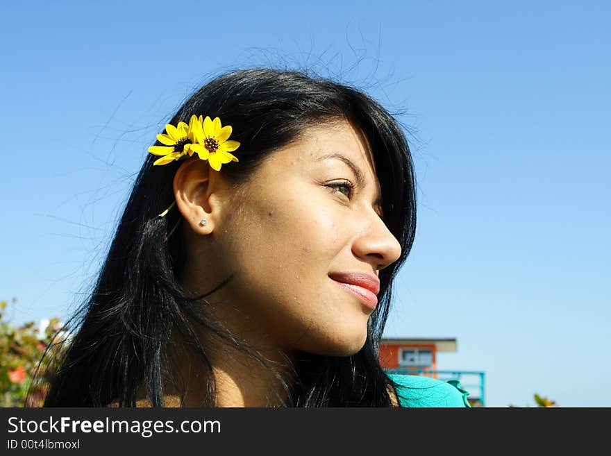 Womans head on a blue sky background. Womans head on a blue sky background