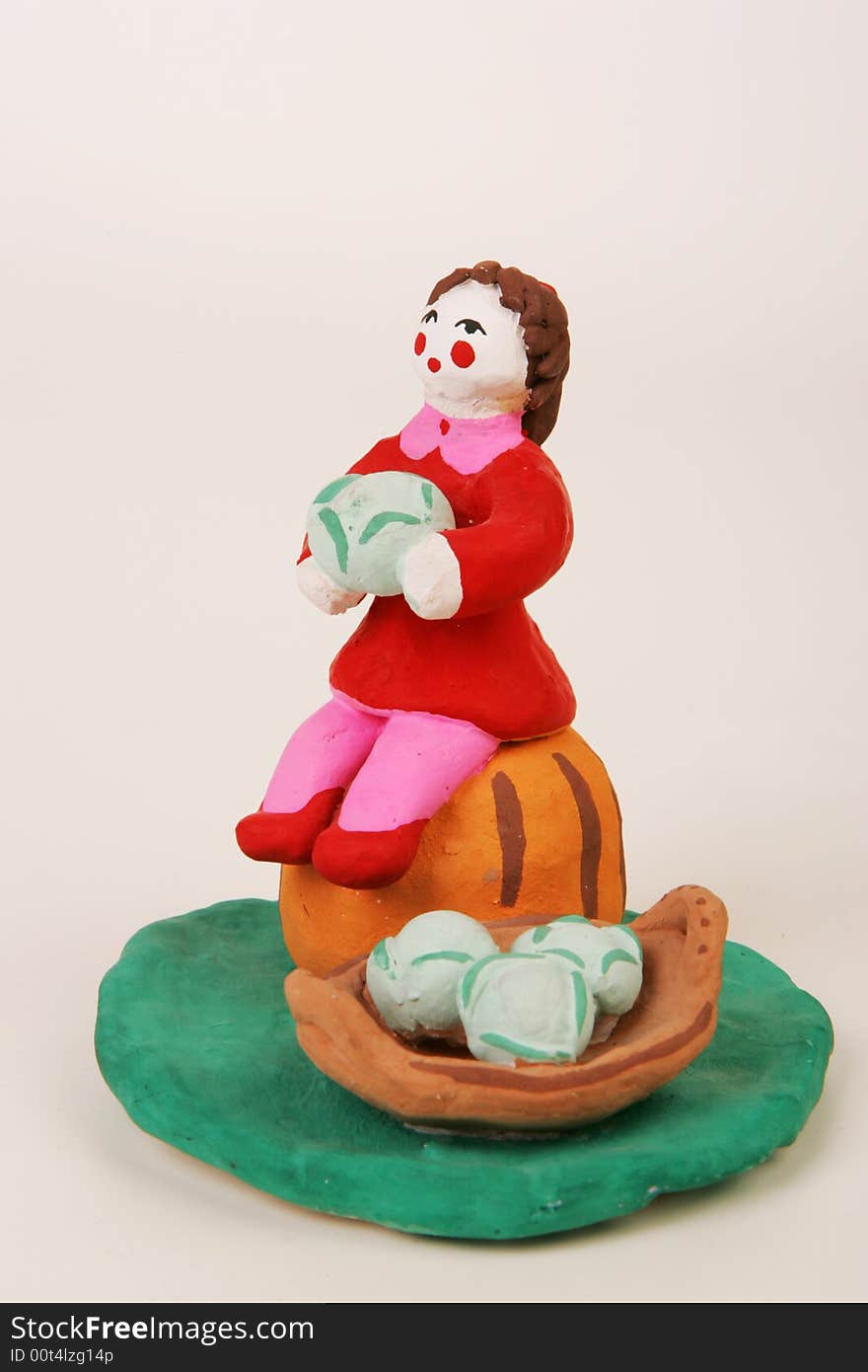 A terracotta statuette of a market trader