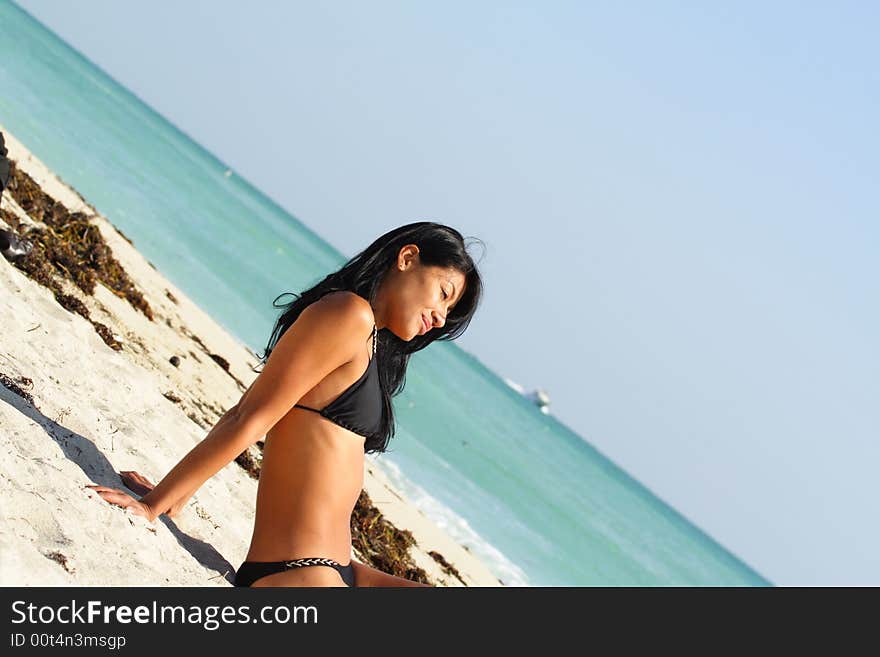 Woman Relaxing On The Beach