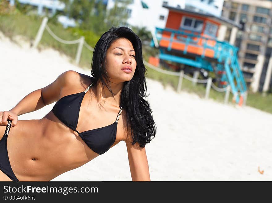 Sexy woman posing on the sand. Sexy woman posing on the sand