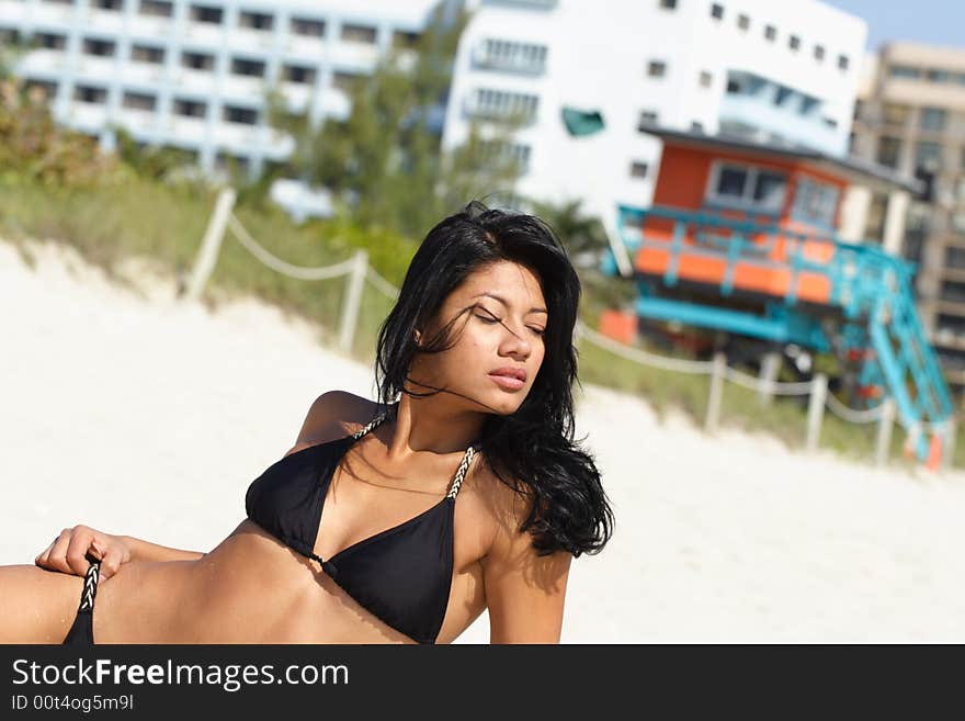 Sexy woman posing on the sand. Sexy woman posing on the sand