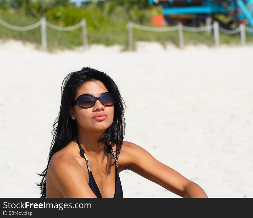 Attractive young woman wearing stylish sunglasses. Attractive young woman wearing stylish sunglasses