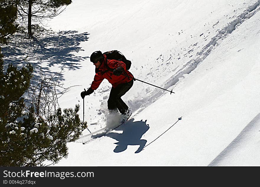 Cutting it close to the tree line on this descent down a steep slope in the backcountry, Ontario. Cutting it close to the tree line on this descent down a steep slope in the backcountry, Ontario.