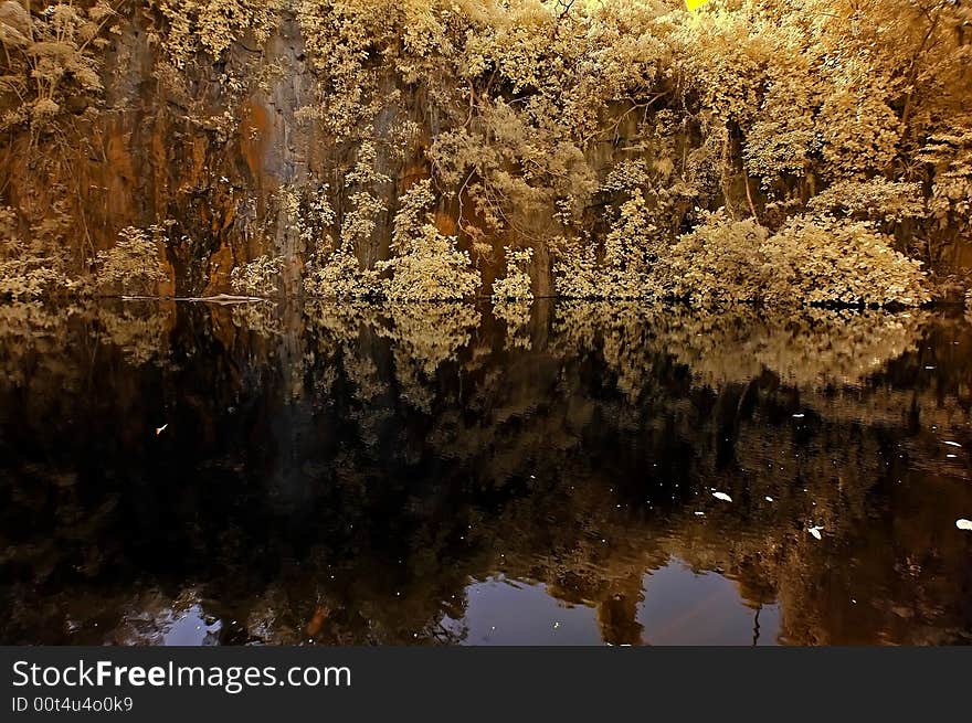 Infrared photo – lake, rock, reflection and tree