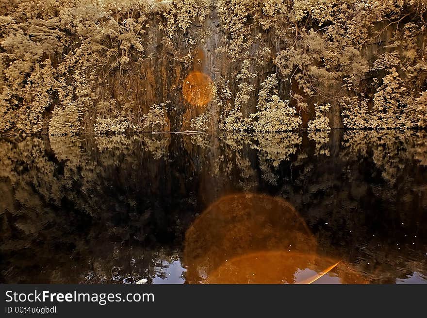 Infrared photo – lake, rock, reflection and tree