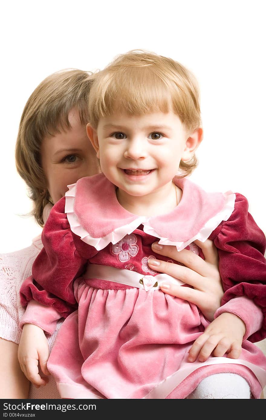 Cheerful mother and baby in formal dress