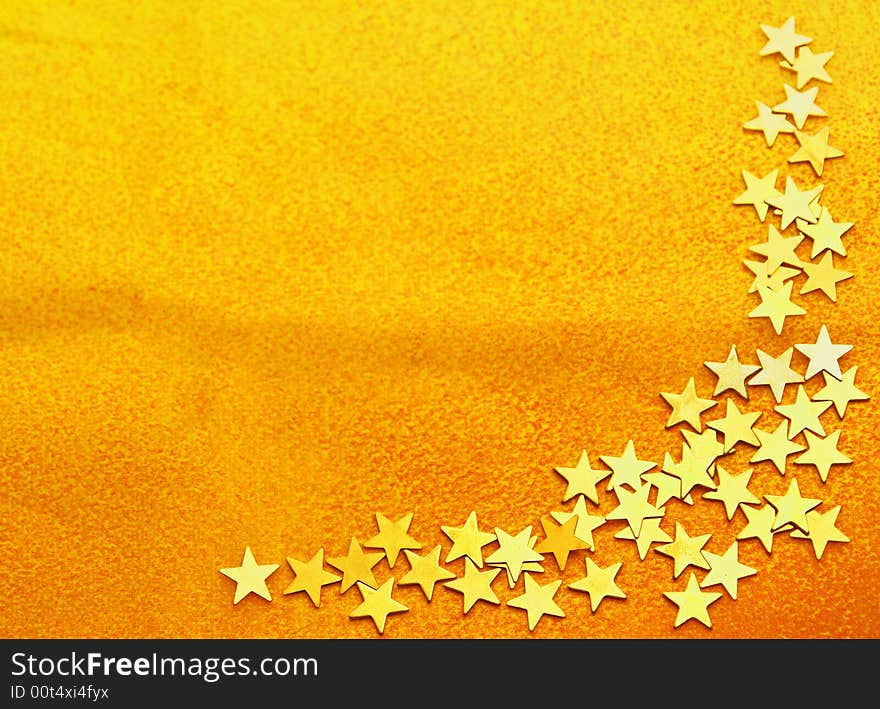 Orange texure background with decorative corner of small golden stars. Orange texure background with decorative corner of small golden stars