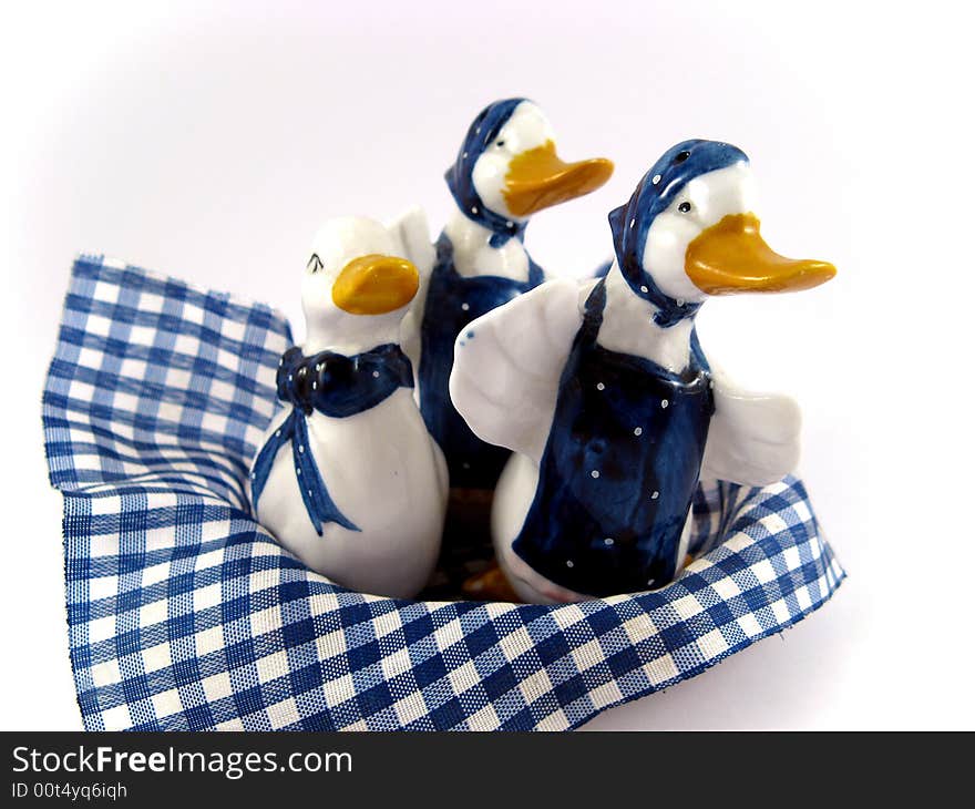 Three porcelain ducks for kitchen decoration isolated on white background