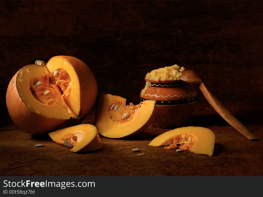 Pumpkin porridge with a wooden spoon