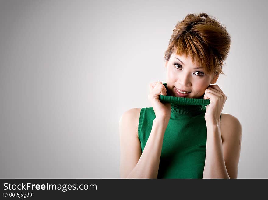 Woman smiling while flipping collar. Woman smiling while flipping collar