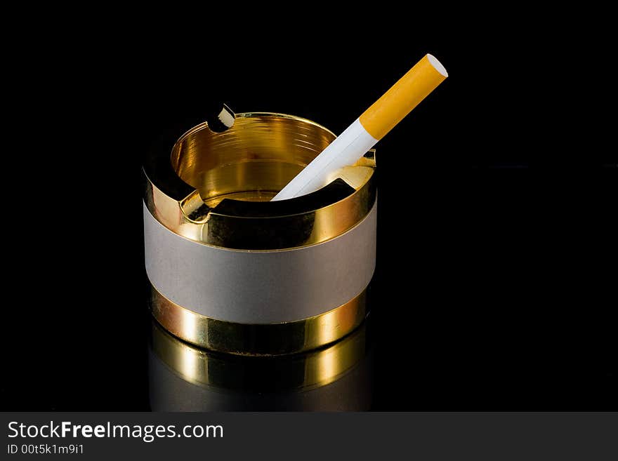 A golden and argentate ashtray. A golden and argentate ashtray