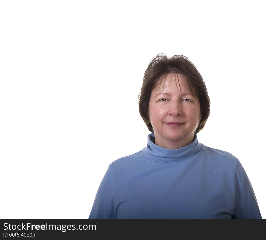 An attractive brunette woman in blue blouse against a white background. An attractive brunette woman in blue blouse against a white background