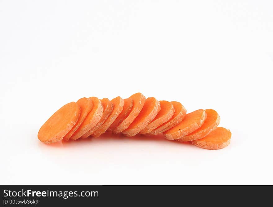 Slices of carrot isolated against a white background. Slices of carrot isolated against a white background