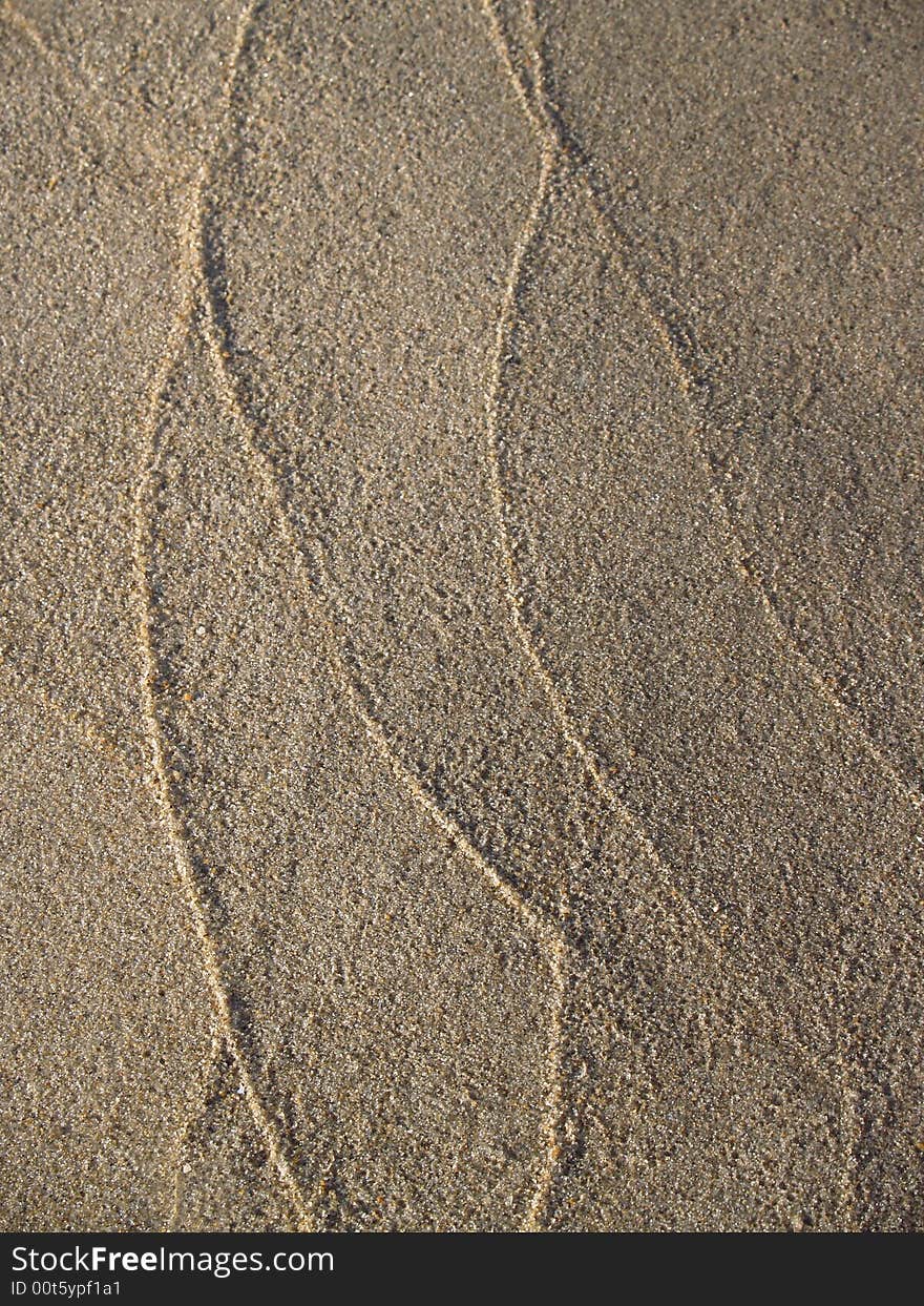 Patterns in sand left by tidal waves on the New Jersey beach of Ocean Grove--  vertical version of a series of two. Patterns in sand left by tidal waves on the New Jersey beach of Ocean Grove--  vertical version of a series of two