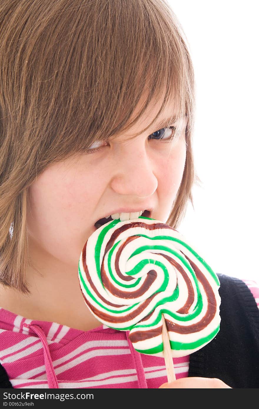 The girl with a sugar candy isolated on a white background