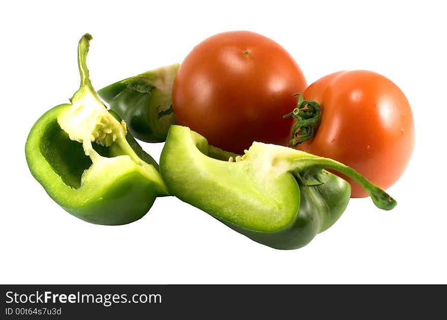 Red tomatoes and green pepper over white. Red tomatoes and green pepper over white